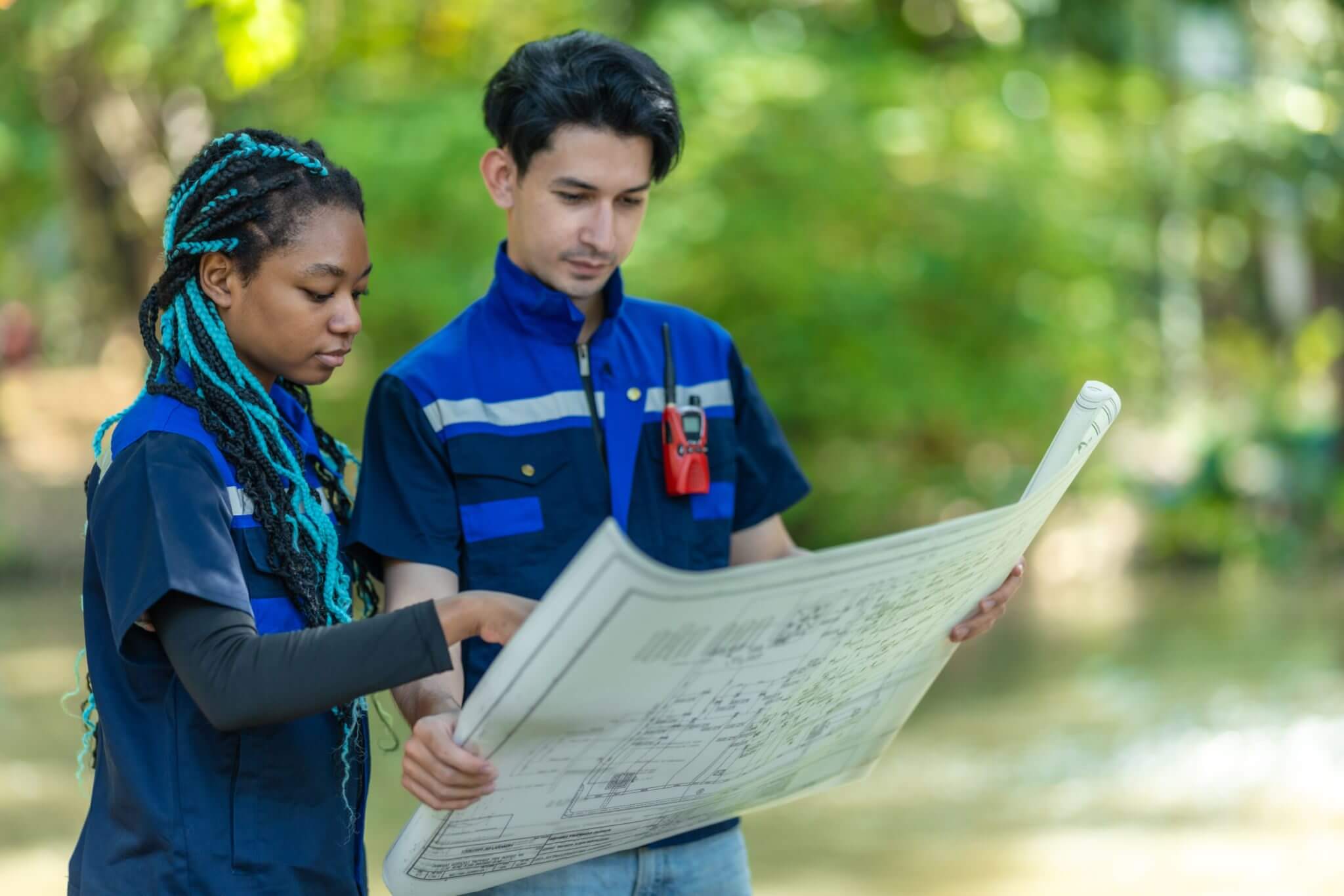Two people studying architectural plans